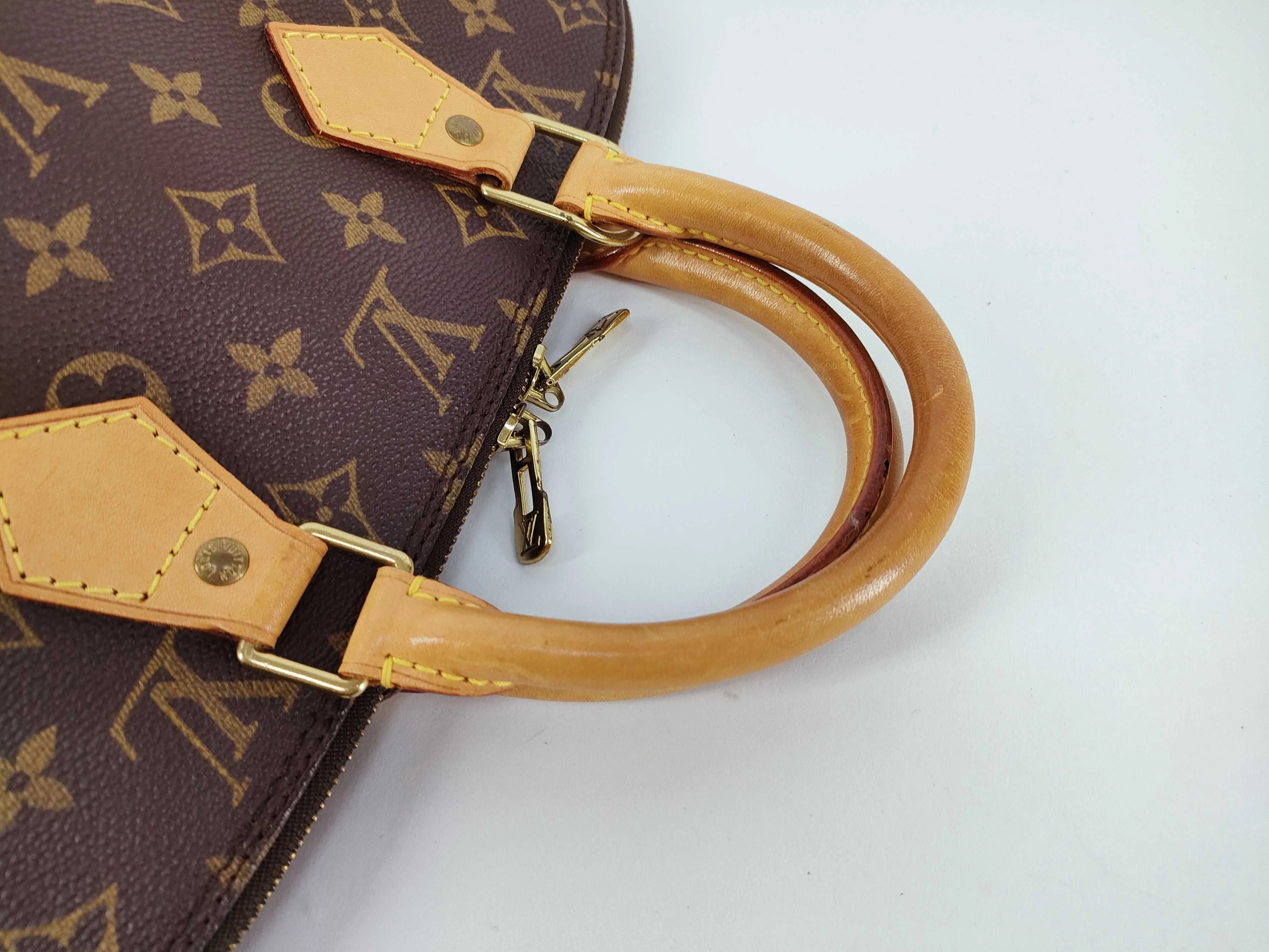 Louis Vuitton Alma Handbag Monogram Canvas - Image 5