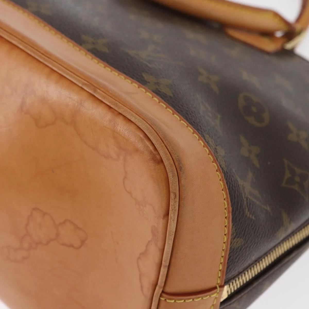 Louis Vuitton Alma Handbag Monogram Canvas - Image 12